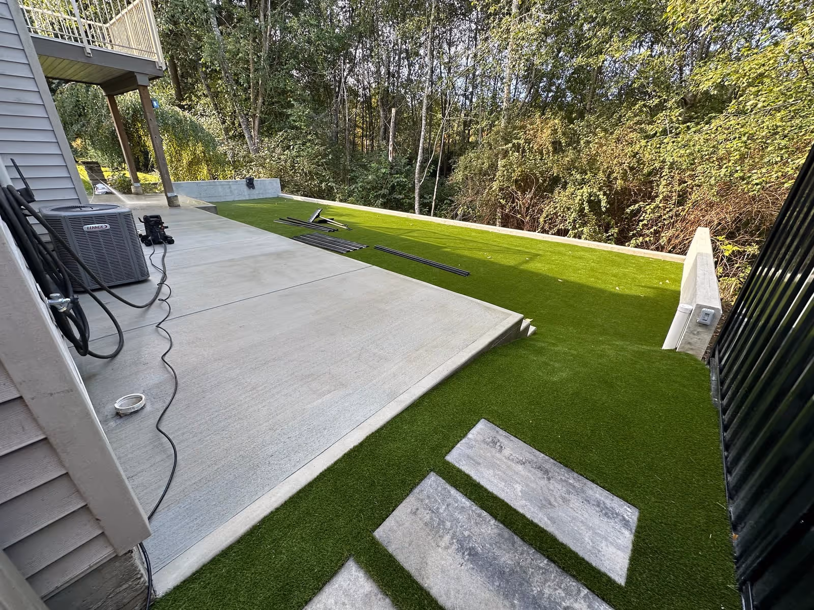 Artificial turf paired with a concrete patio