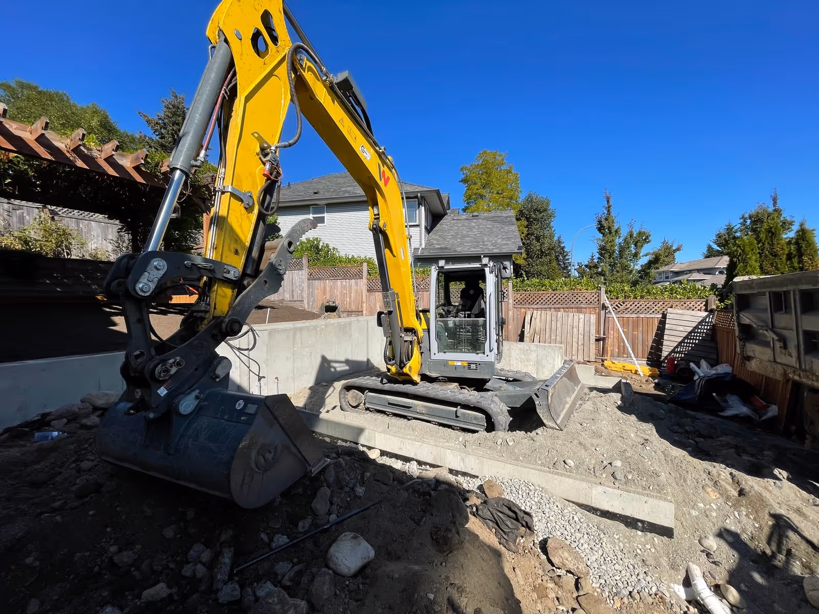 Excavator on a residential demolition job