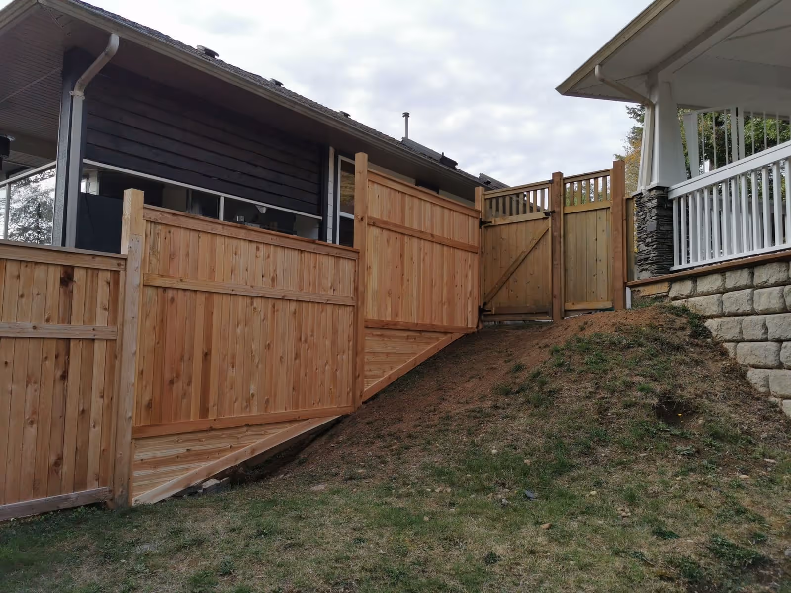 Cedar wood fence on a hillside lot