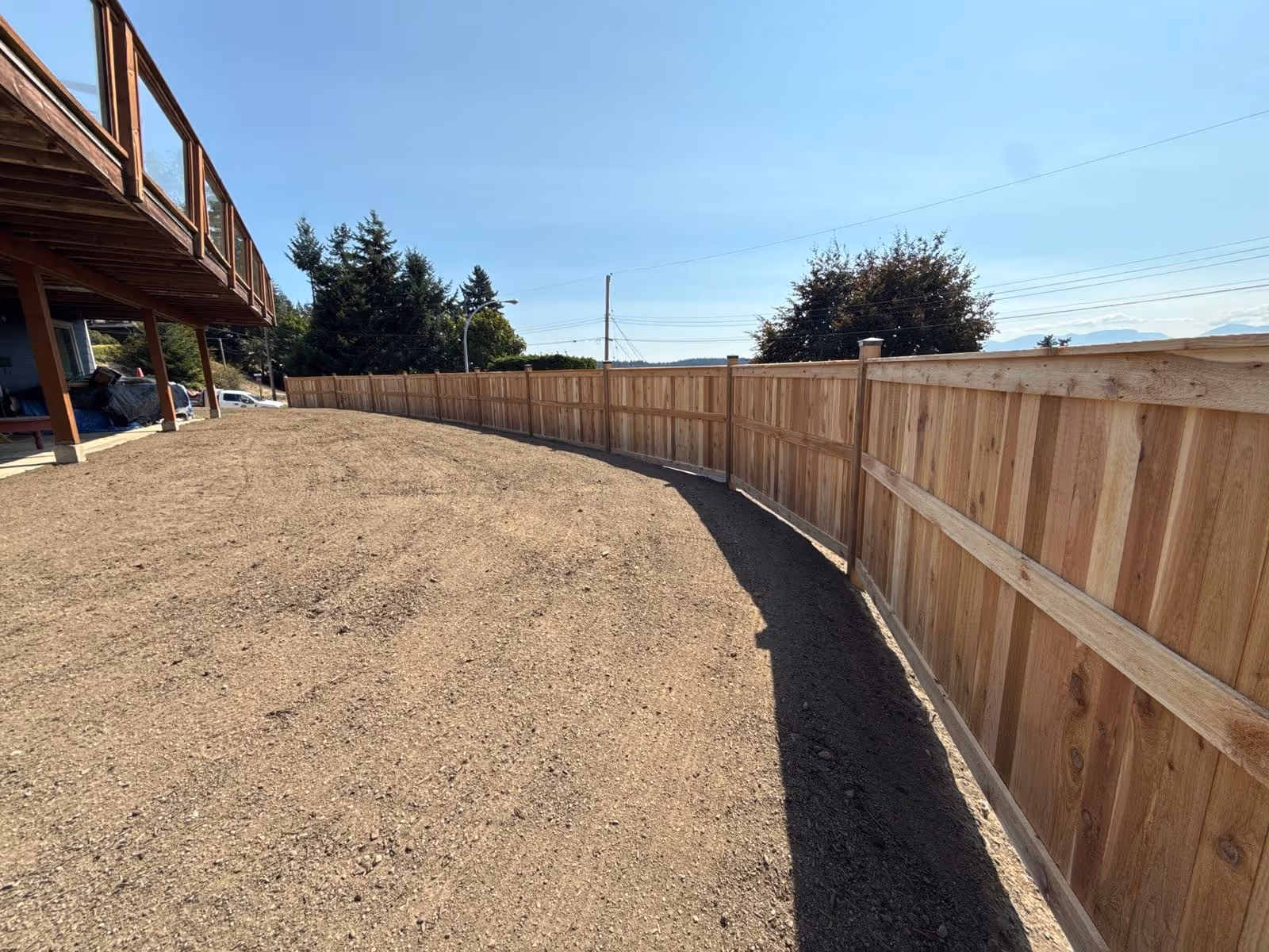 Long cedar fence following a yard perimeter