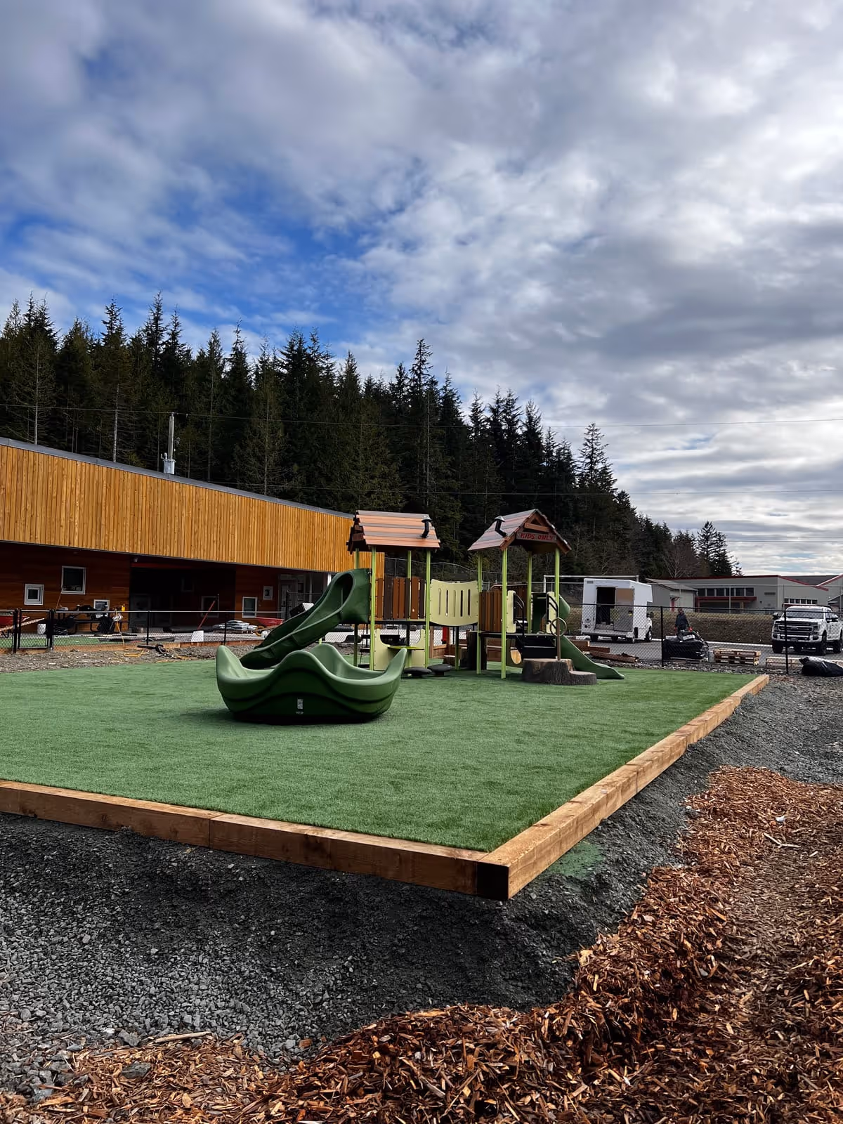 Commercial playground with artificial turf surfacing