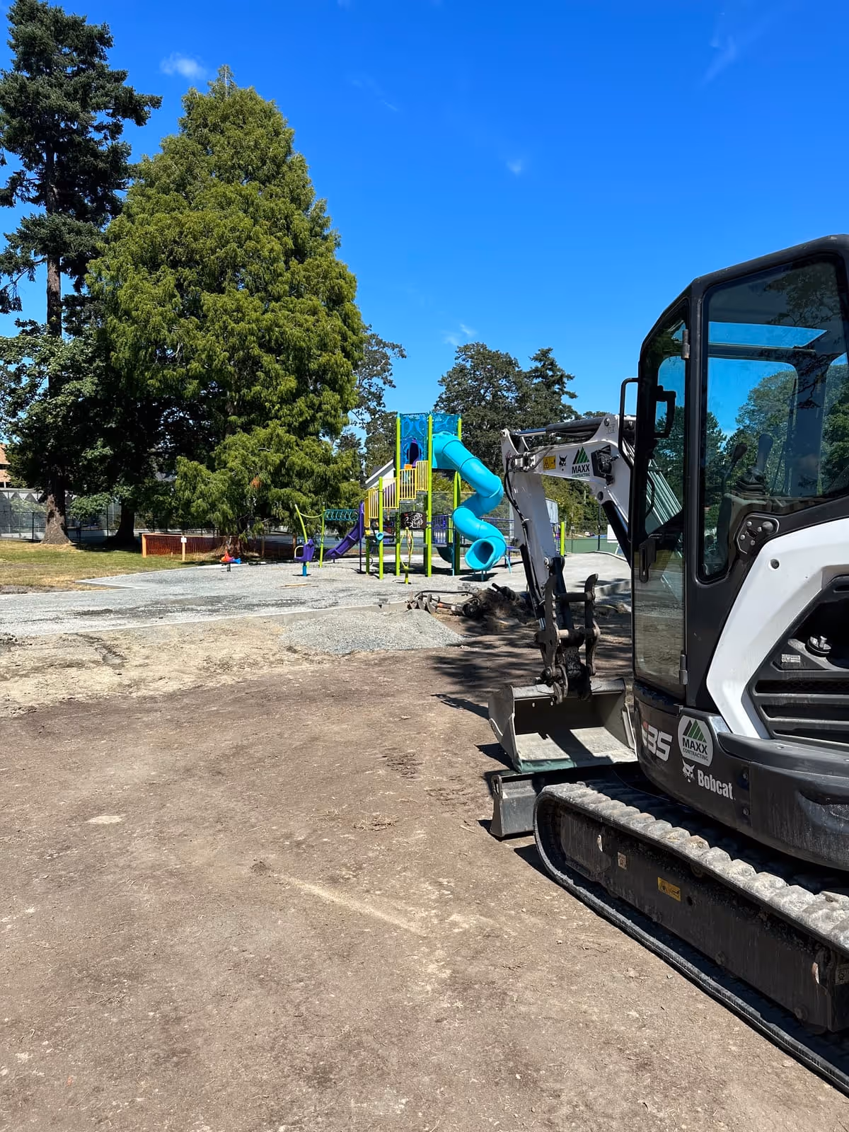 Excavator preparing a playground site in Nanaimo