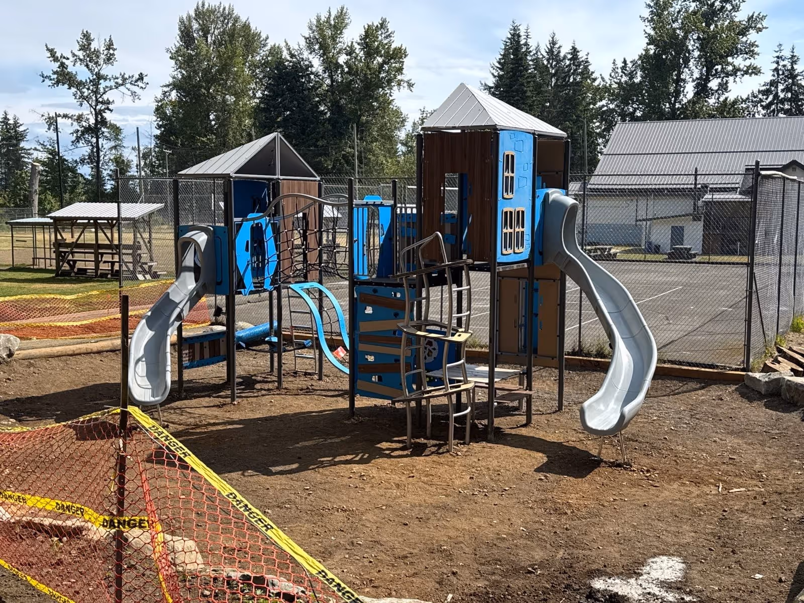 Playground under construction with blue equipment