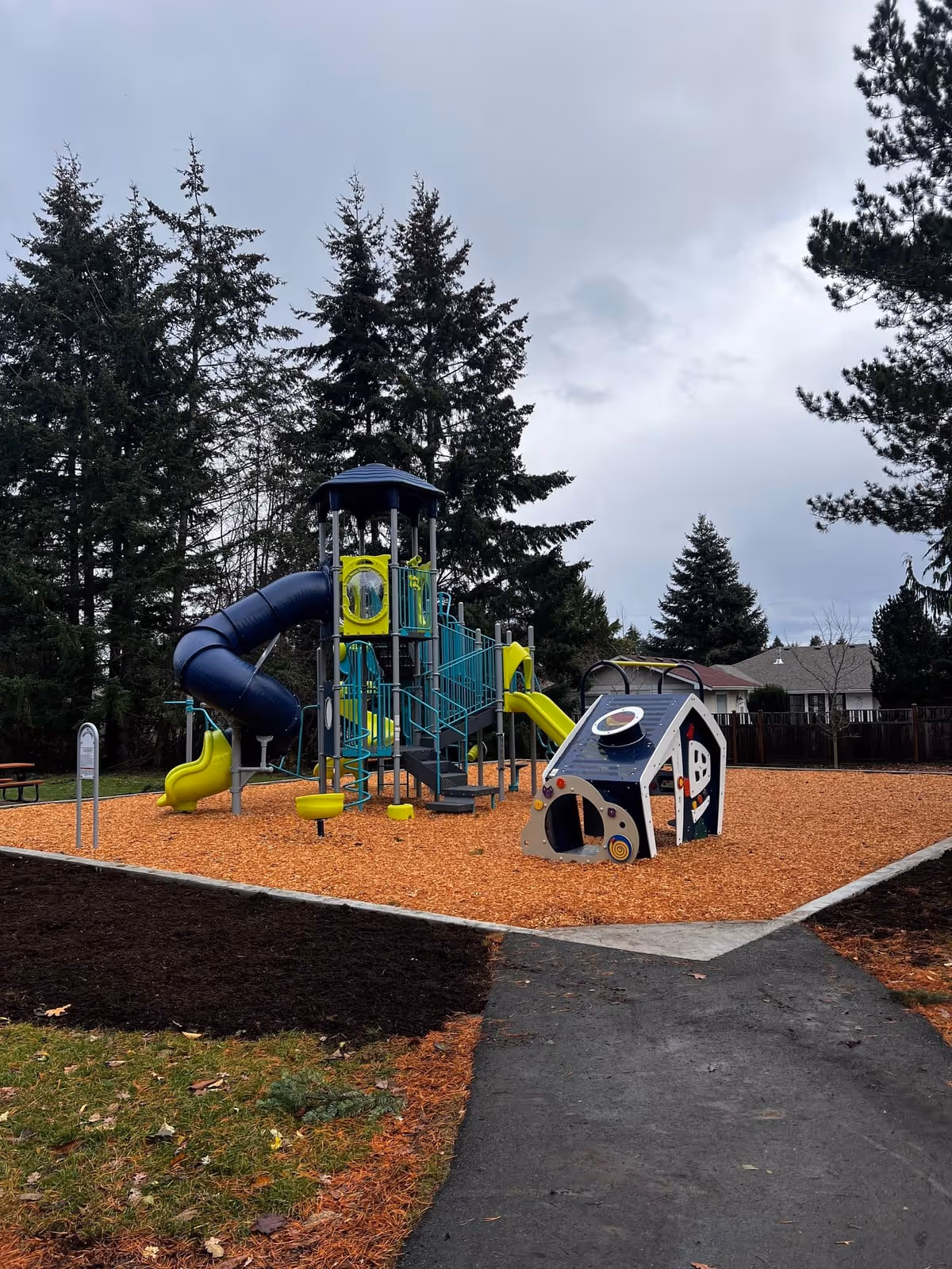 Playground with a blue tube slide