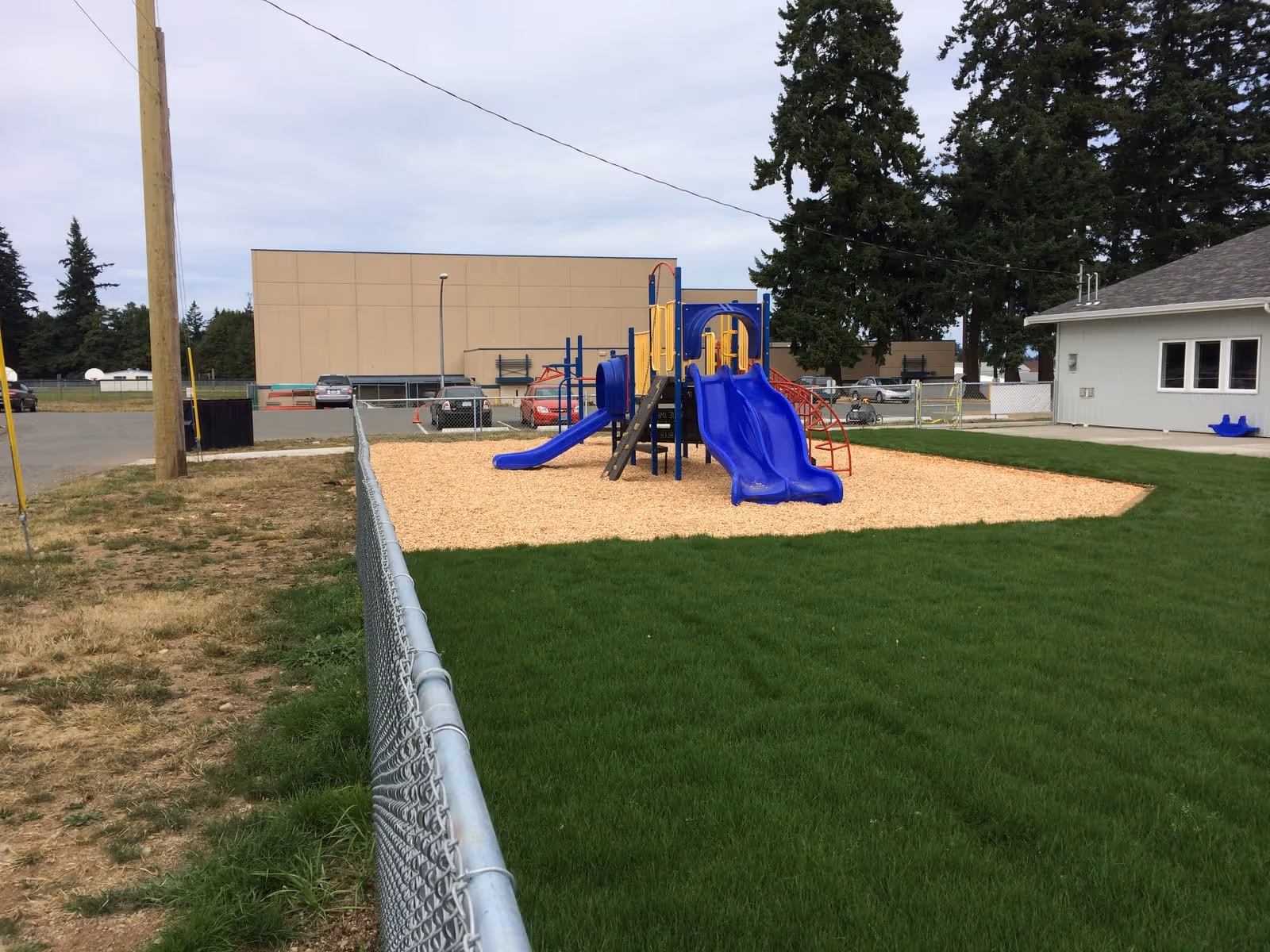 School playground with blue and yellow equipment