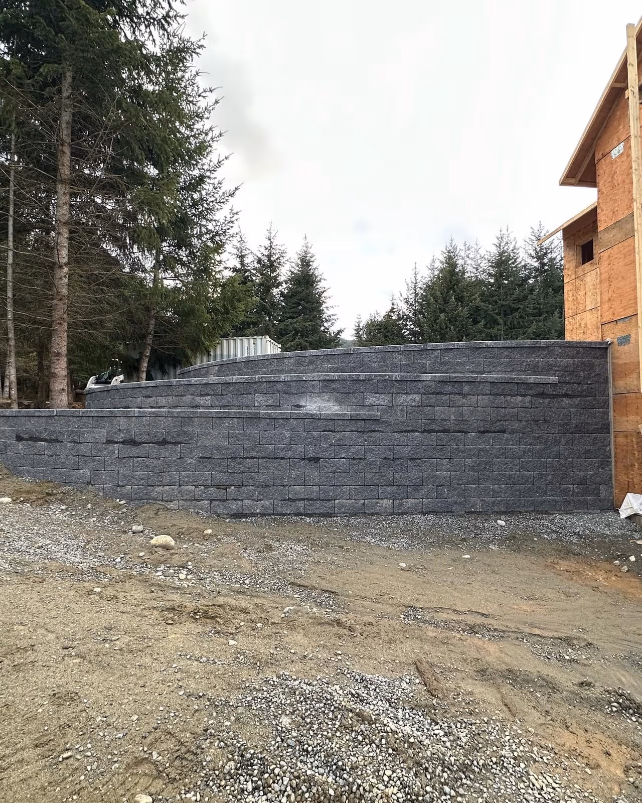 Dark block retaining wall under construction
