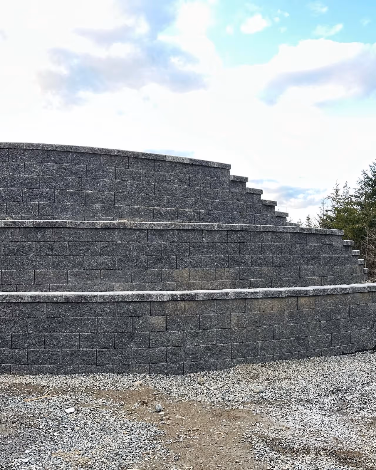 Large tiered dark block retaining wall