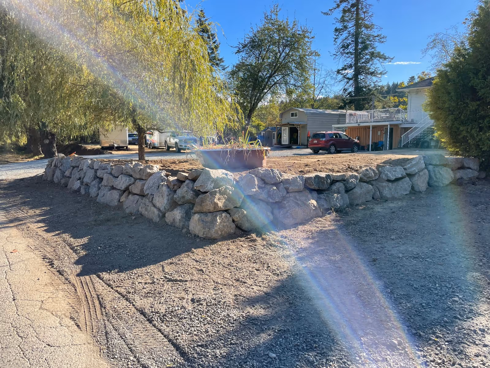 Curved natural boulder retaining wall